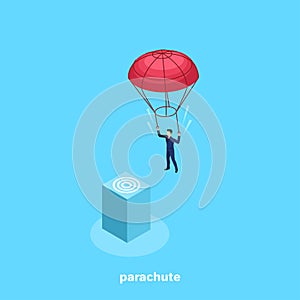 A man in a business suit descends with a parachute on the target