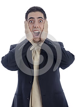 Man in business suit with his hands on his face shouting in desperation