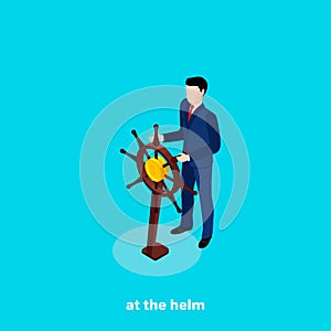 A man in a business suit is holding a ship`s steering wheel
