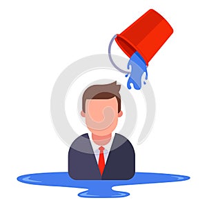 a man in a business suit is poured with water from a bucket.