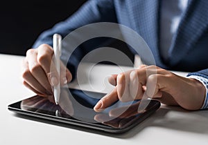 Man in business suit using digital tablet computer