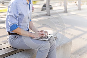 Man Businessman Freelancer working on his laptop outdoors