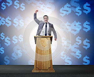 Man businessman making speech at rostrum in business concept