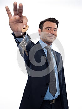 Man Businessman realtor teasing holding keys photo