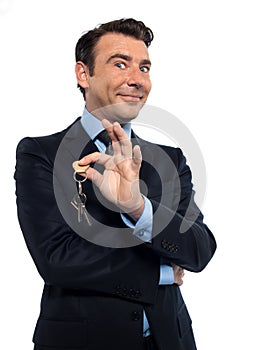 Man Businessman realtor teasing holding offering keys photo