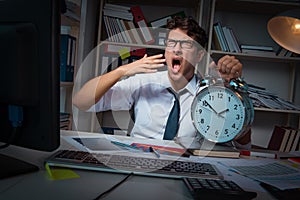 The man businessman working late hours in the office