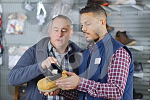 Man buyin yellow winter boots