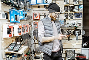 Man buying bicycle parts at the shop