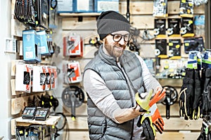 Man buying bicycle parts at the shop