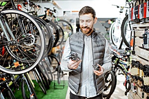 Man buying bicycle parts at the store