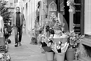 Man buying CHristmas flowers at florist