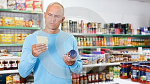 Man buying food in supermarket