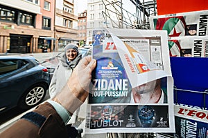 Man buying latest news sport Zinedine Zidane coach of Real Madrid