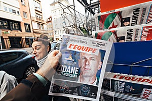 Man buying latest news sport Zinedine Zidane coach of Real Madrid