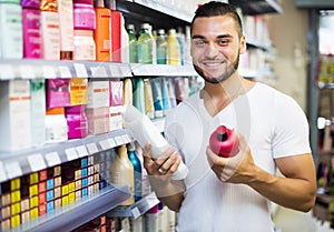 Man buying shampoo