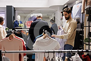 Man buying summer clothes during sales