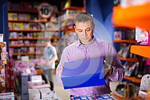 Man buying toys in store