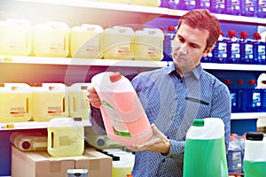 Man buys windshield washer fluid in shop