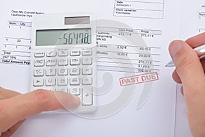 Man Calculating Past Due Statement