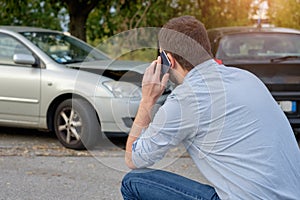 Man calling car mechanic insurance