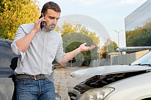 Man calling car mechanic insurance assistance