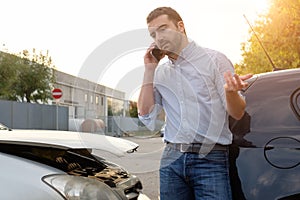 Man calling car mechanic insurance assistance after car accident