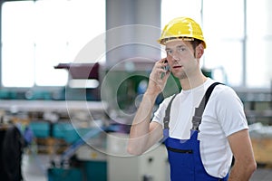 Man calling in factory