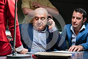Man calling his attorney for an interrogation at the police photo