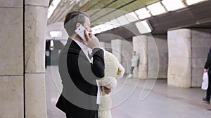 Man is calling his sweetheart on the phone.