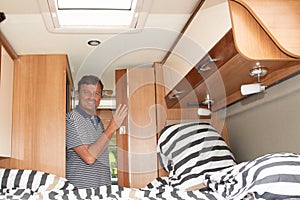 Man in campervan motor home during vanlife vacation in RV