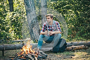 Man camping in forest. Tourists relaxing. Tourism concept. Picnic time.
