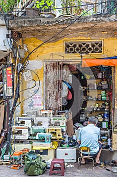 A man can seen repairing sewing machine in Hanoi Old Quarter, capital of Vietnam.