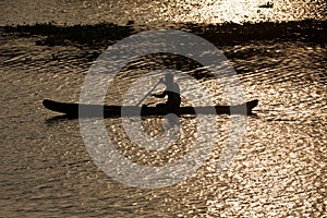 Man in canoe. Kerala backwaters,