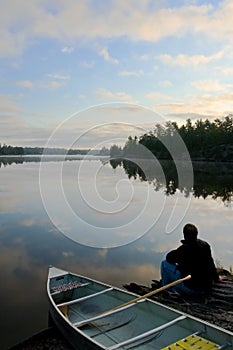 Man, Canoe and sunrise