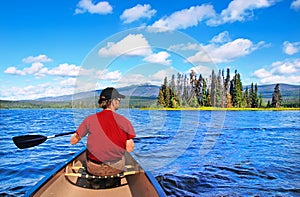Man canoeing on a lake in British Columbia, Canada