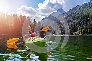 Man Canoeing In Misurina Lake In Italy