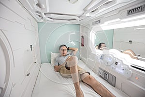 Man in capsule hotel