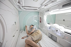 man in capsule hotel