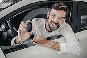 Man in car dealership