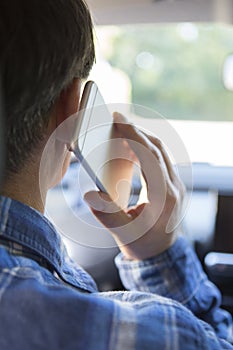 Man In Car Talking On Mobile Phone Whilst Driving