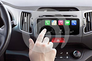 Man in a car and touch play auto smart system