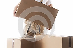 Man with cardboard box in hands. Relocation services. Mover with boxes. Loader.