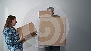 Man with cardboard boxes, delivery male holds and drops things. Falling storage