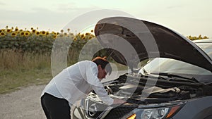 Man carefully looks on the fuel level of his car