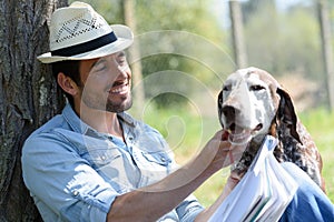 Man caressing his dog