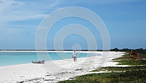 Man on Caribbean white sand beach