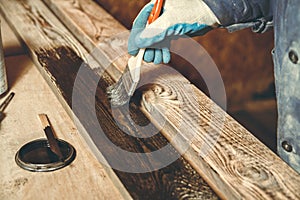 Man carpenter in his home manufactory