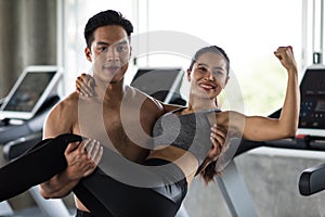 Man carry woman on in fitness gym