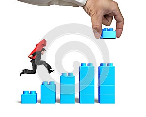 Man carrying arrow up running bar graph block hand building