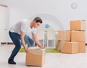 Man carrying boxes at home